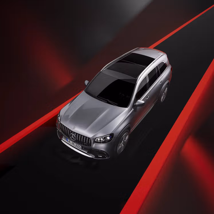 Side-front view from above of the new Mercedes-AMG GLS 63 SUV in silver colour.