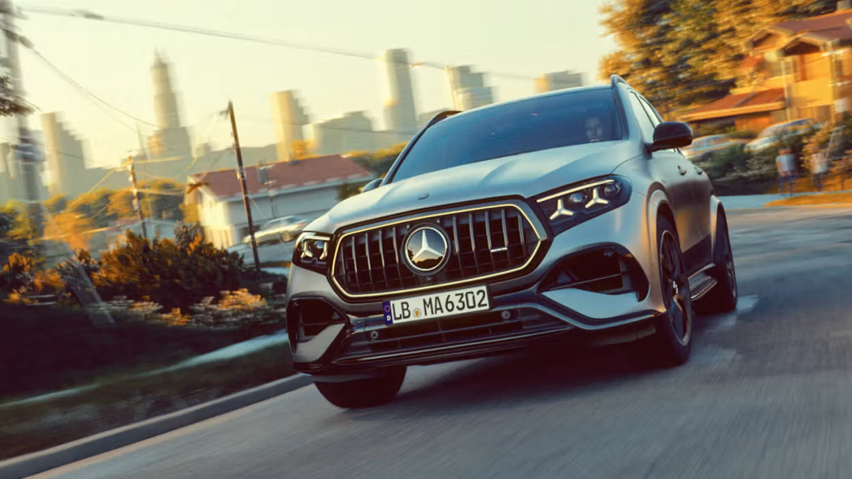 A Mercedes-AMG GLE SUV with a city in the background