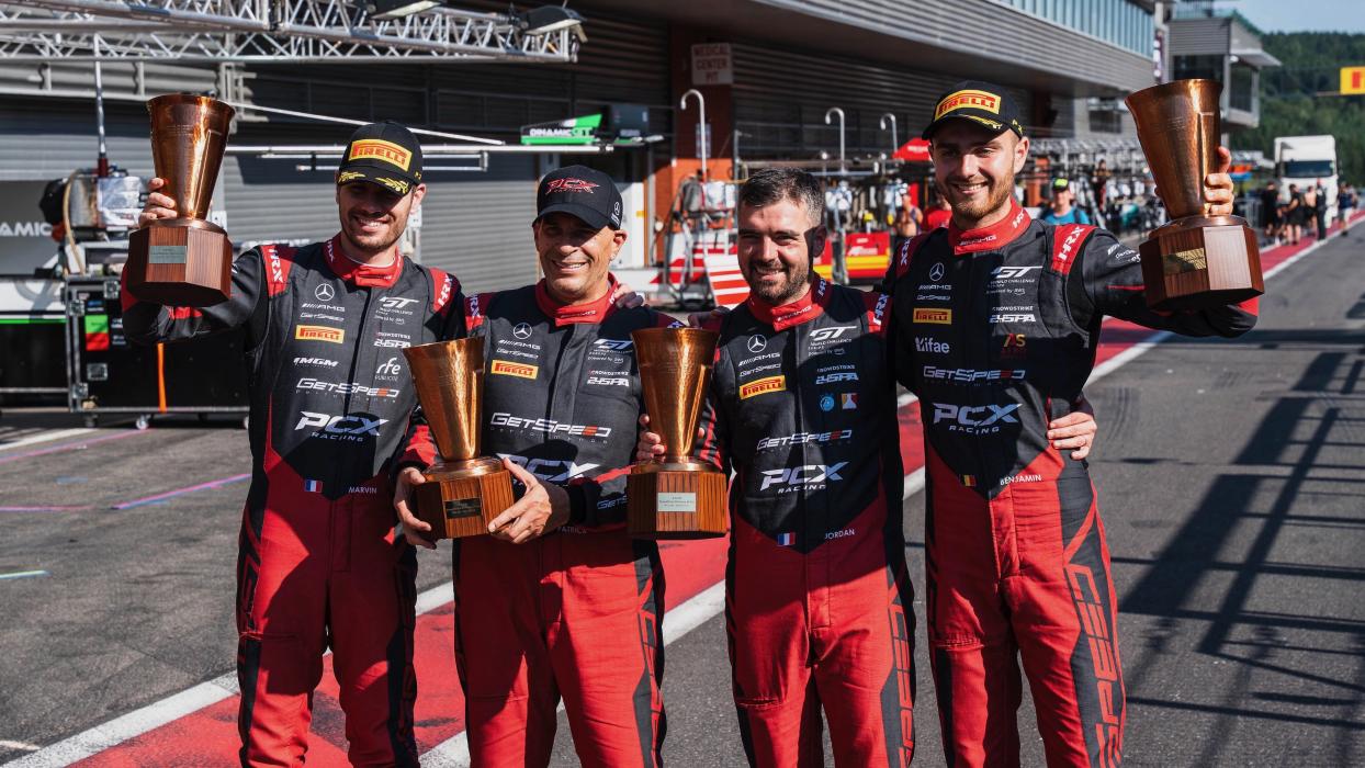 Mercedes-AMG GT racing drivers hold their trophies aloft