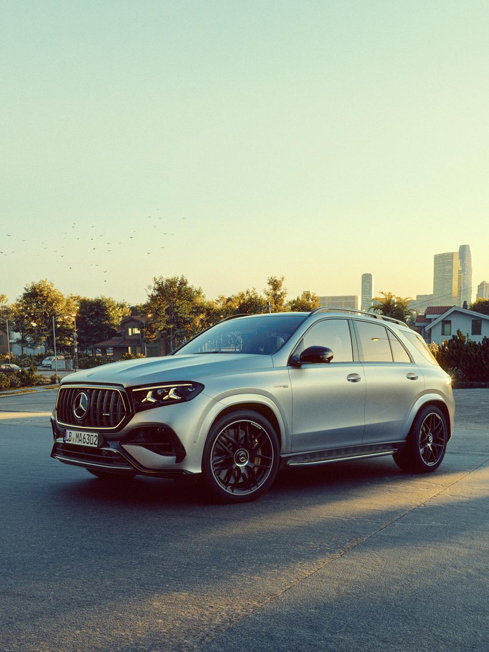 A Mercedes-AMG GLE SUV with a city in the background