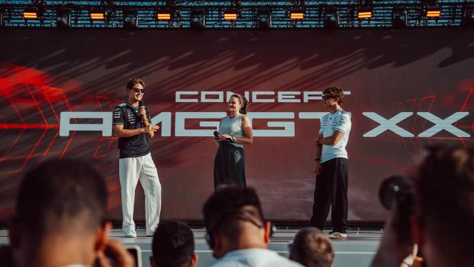 Kimi Antonelli and George Russel on stage in front of a CONCEPT AMG GT XX banner
