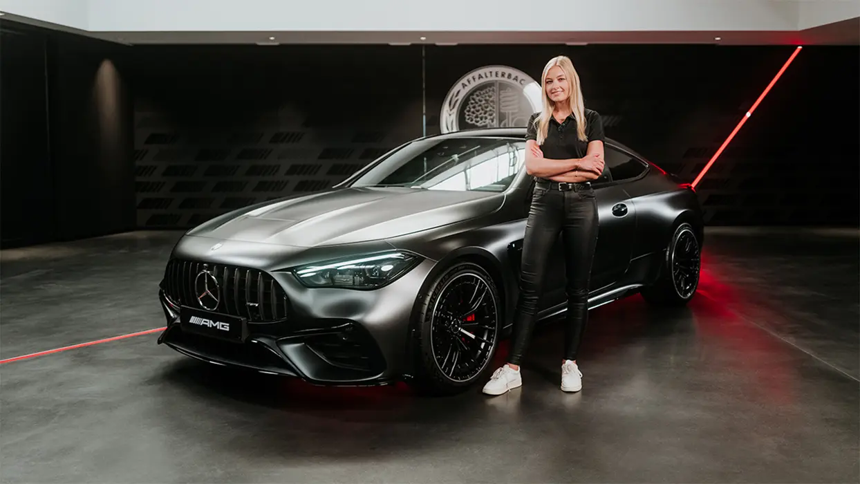 Product manager Sabrine in front of the Mercedes-AMG CLE 53 Coupé.
