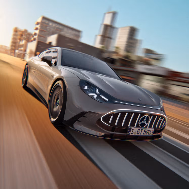 The Mercedes-AMG GT 55 4-Door Coupé driving in an urban setting