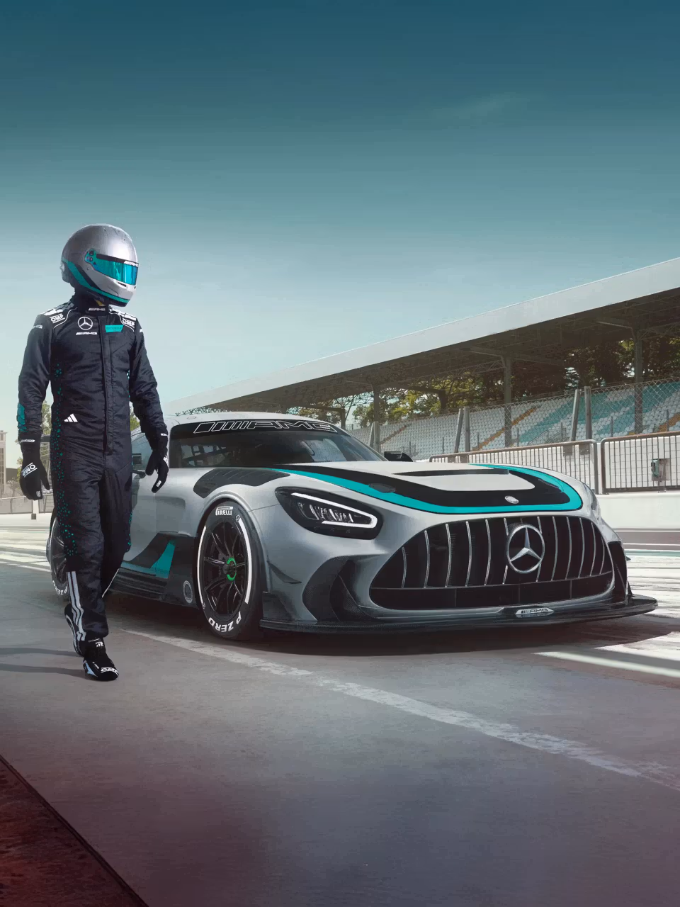 Racing driver runs alongside parked Mercedes-AMG GT2 Edition W16